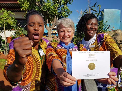 Sinikiwe Makove, Miranda Curtis and Clarah Zinyama on the CAMFED Garden.