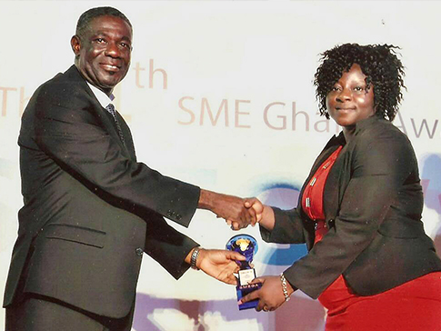 Esther receiving her Woman of the Year Award