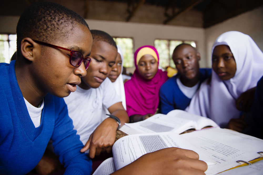 Students in Tanzania working collaboratively on the Camfed life skills curriculum Students in Tanzania working collaboratively on the Camfed life skills curriculum
