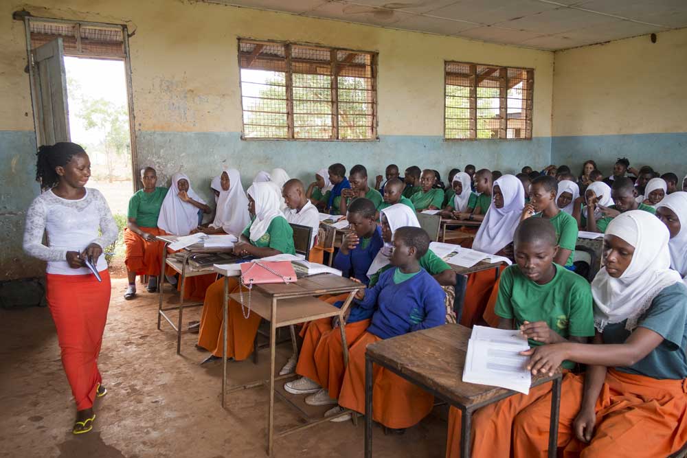Camfed Learner Guide Shany delivers a life skills curriculum in rural Tanzania Camfed Learner Guide Shany delivers a life skills curriculum in rural TanzaniaCamfed Learner Guide Shany delivers a life skills curriculum in rural Tanzania