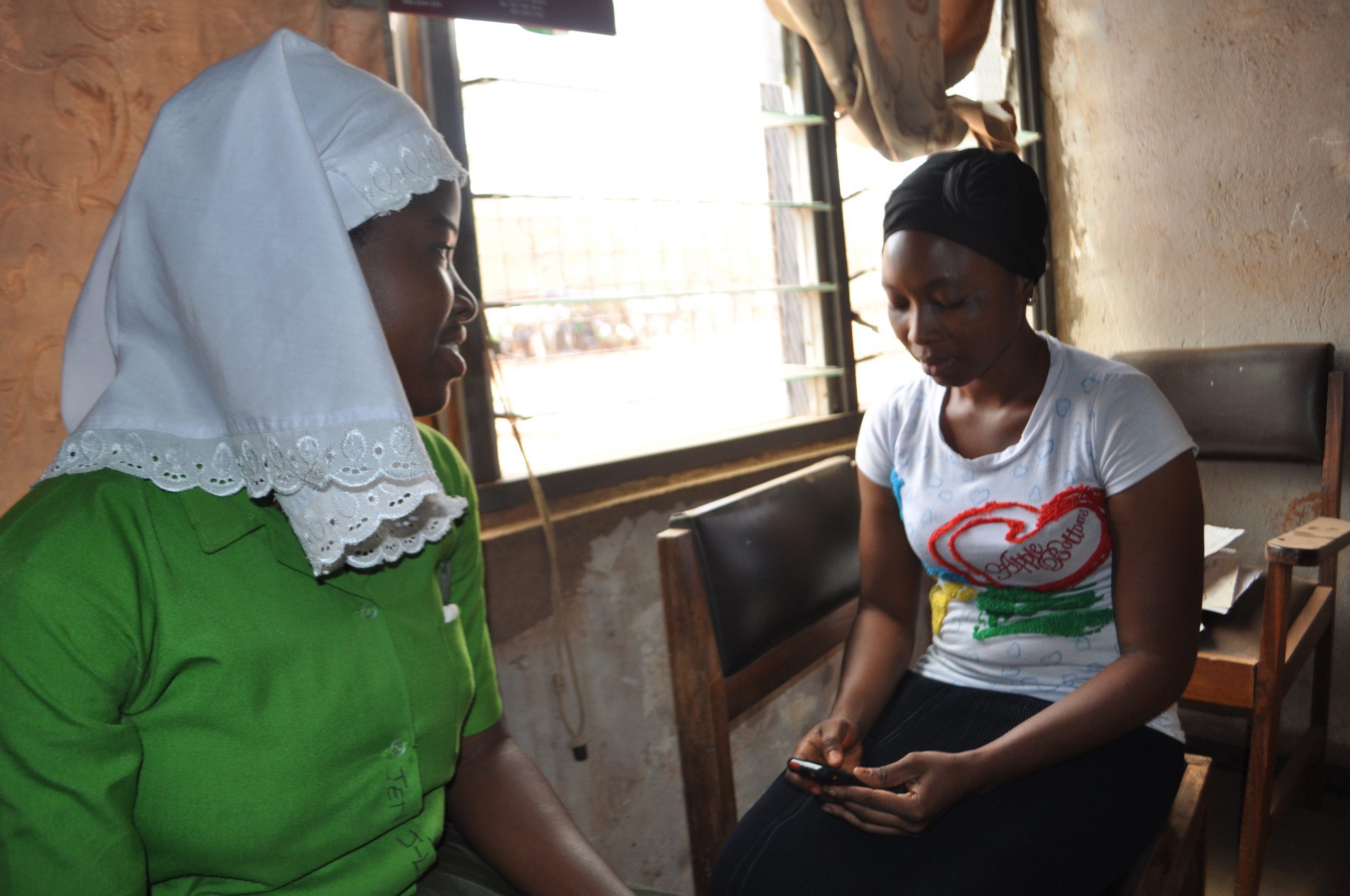 Zubaida, a Camfed trained enumerator, is collecting data for verification in Sagnarigu district in Ghana