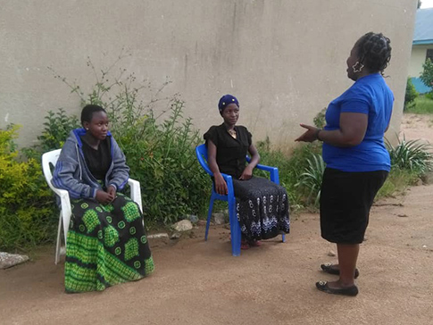 Teacher Mentor Gaudencia meets with students to support them whilst schools are shut. 