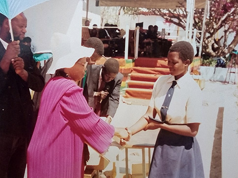 Lucia receives a prize at secondary school Lucia receives a prize at secondary school