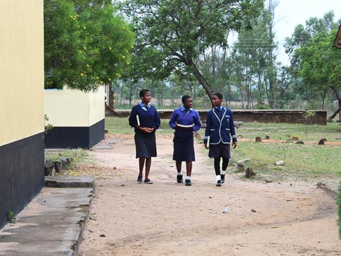 Aneni walking with two friends Aneni walking with two friends