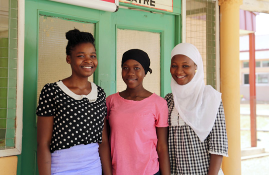 Sukuratu with fellow CAMA volunteers training as health professionals