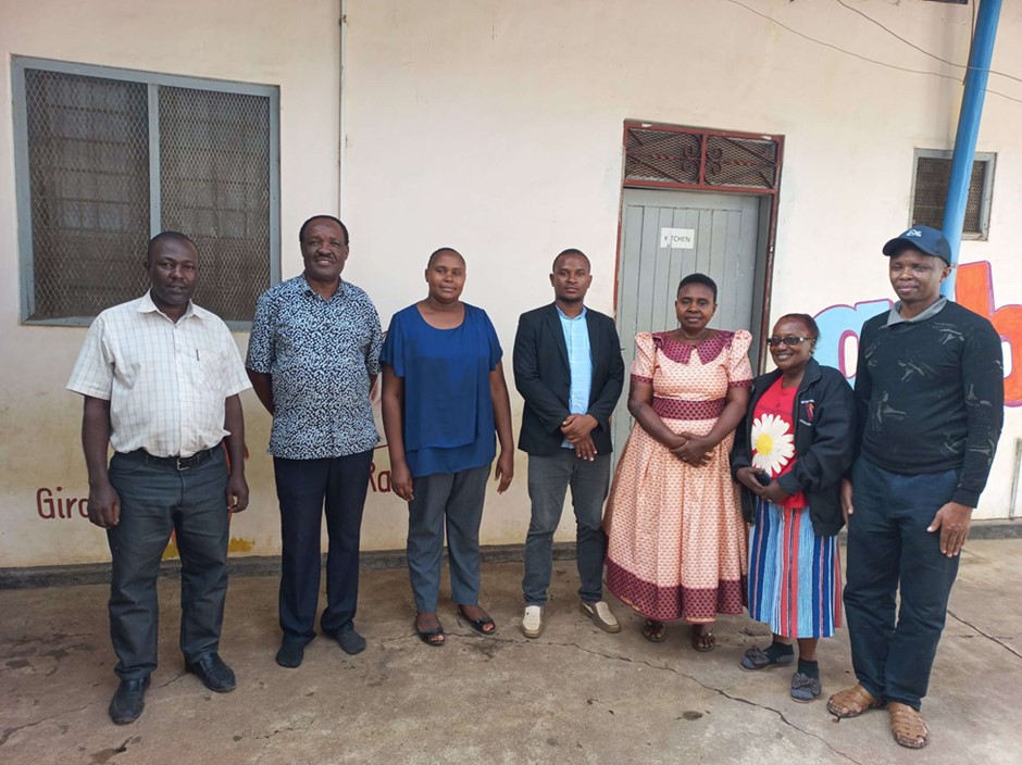 Neema, in the blue top, with the members of her Parent Support Group