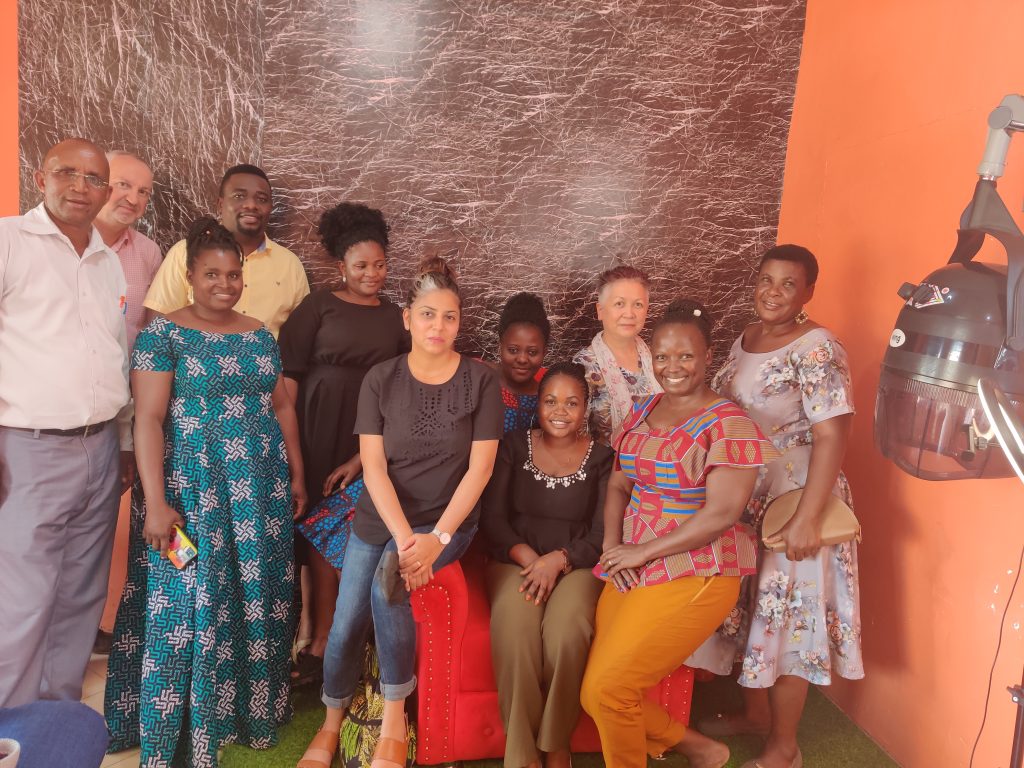 Mariam welcomes visitors from the Foreign, Commonwealth and Development Office (FCDO), CAMFED team and community members to her salon