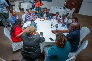 A workgroup at CAMFED's regional scaling advisory committee convening including students in Dar es Salaam in November 2022