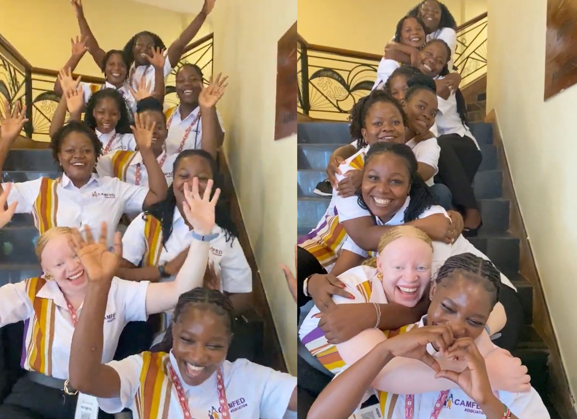 Gift (bottom left), a smiling Zambian woman, sitting on the steps of a staircase inside with a group of young women in the CAMFED Association.